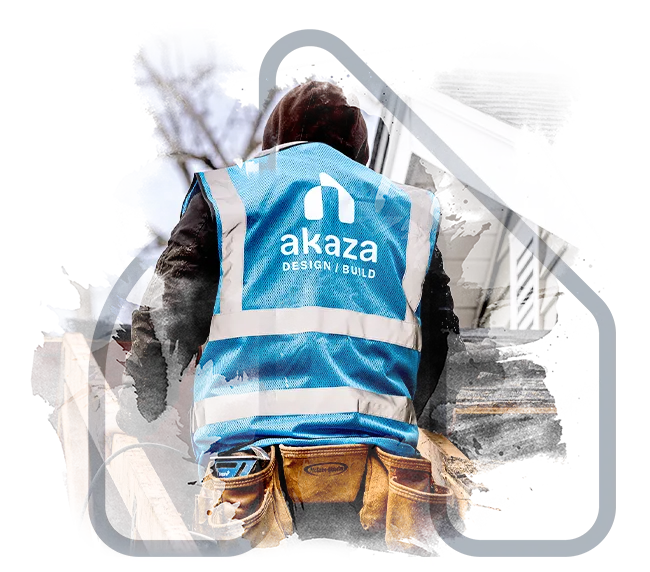 A professional from Akaza Builders in uniform working on a residential project in Central MA, showcasing expert construction management.